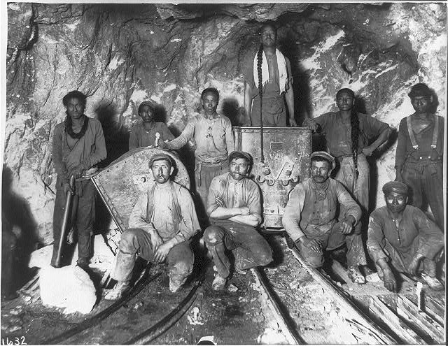 Black, Chinese and White laborers in a gold mine in South Africa, c. 1902. 