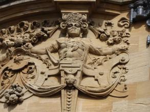 Detail from the wall of the Indian Institute, depicting a Hindu god